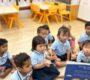 Preschool children listening storytime Starshine Montessori 90x80