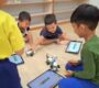 Preschool kids coding robots tablets AI learning Starshine Montessori 90x80