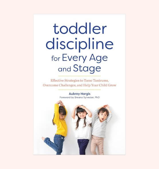 Book cover of "Toddler Discipline for Every Age and Stage" by Aubrey Hargis, featuring three young children posing playfully.